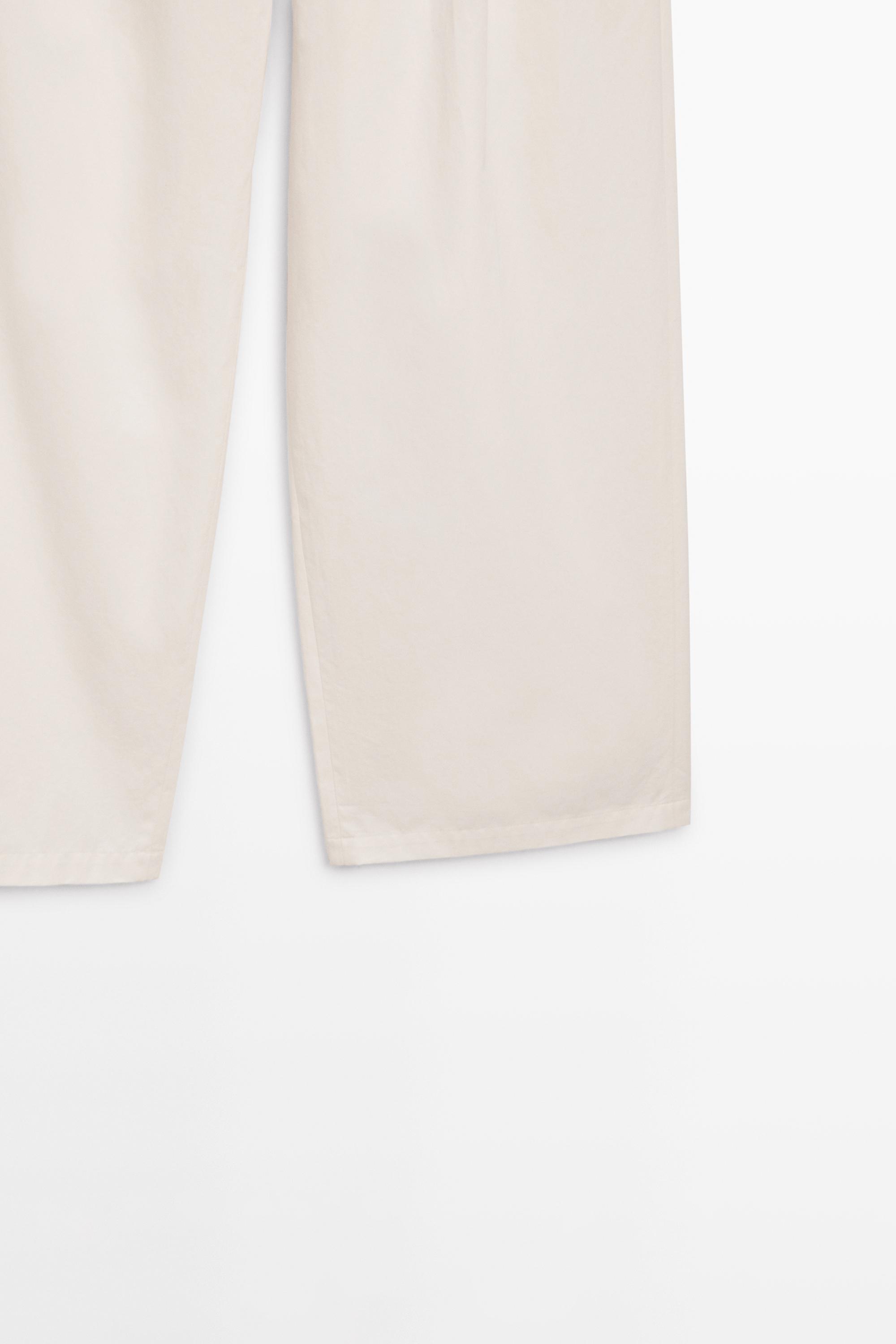 Pleated trousers with crossover fastening - STUDIO